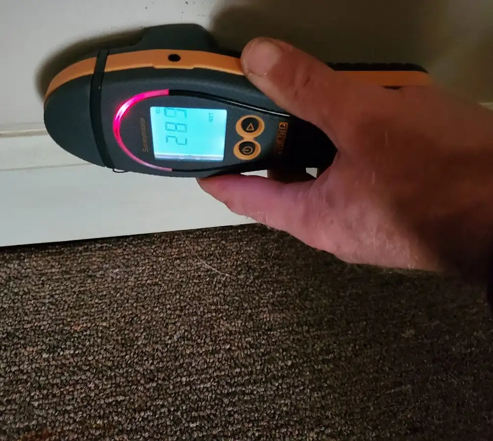 Moisture detection at baseboard during Storm Damage Restoration in Chesterfield